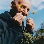 elderly man discovering edible plants