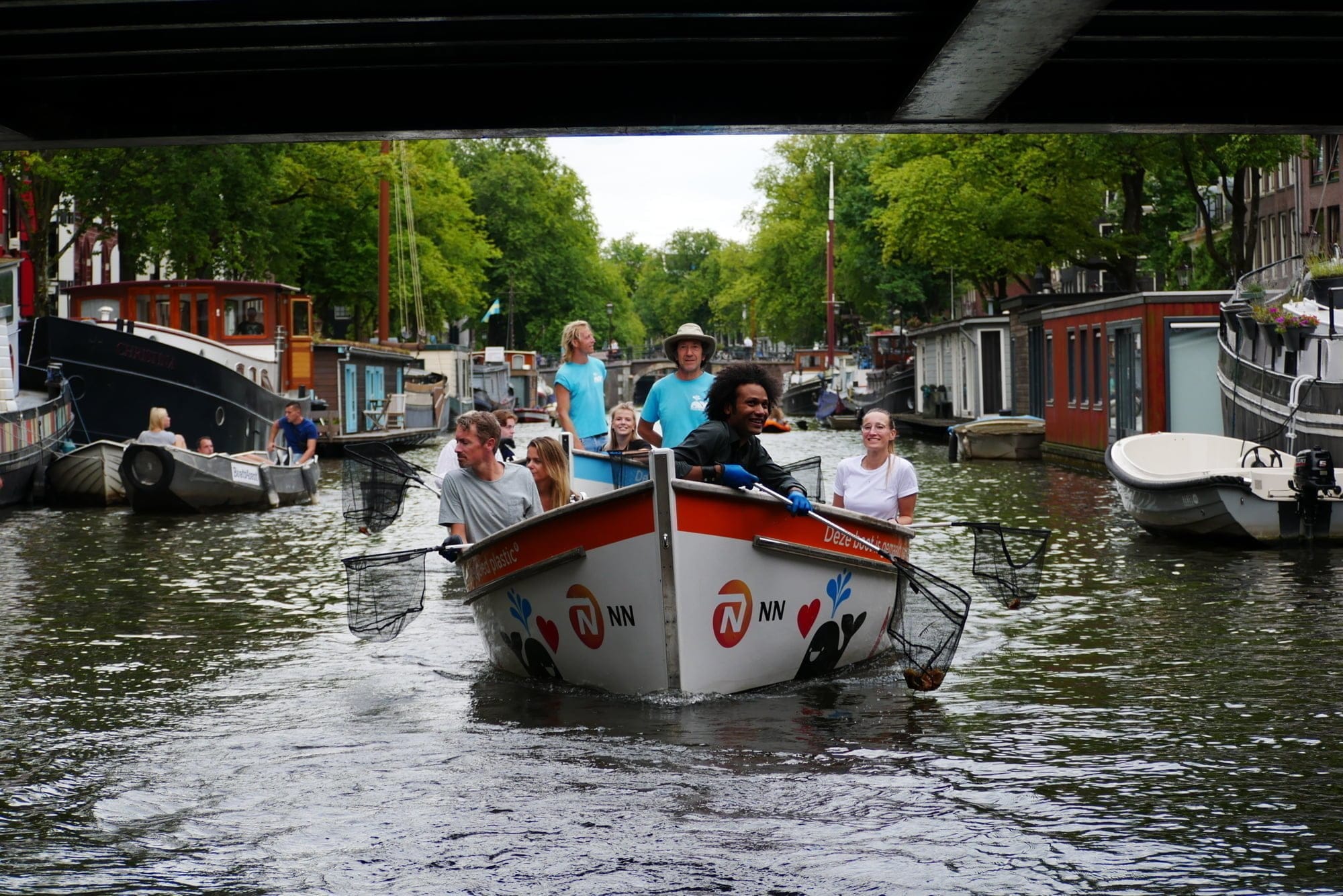 amsterdam boat on canals collecting waste a sustainable initiative